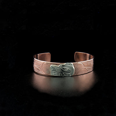 Sterling silver and copper bear bracelet hand-carved by Kwakwaka'wakw artist John Lancaster. 6.13" long with 1.13" gap. 0.50" wide.