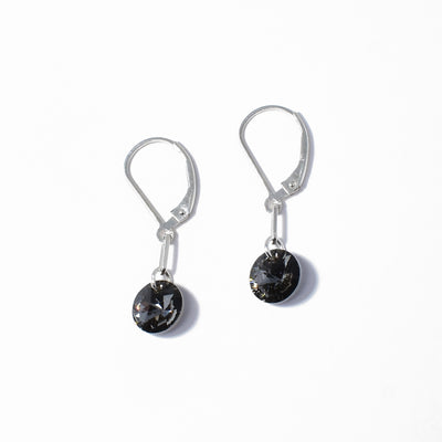 Elegant lever back earrings handcrafted by artist Debra Nelson. Made of sterling silver and Swarovski Crystal. Each earring measures 1.13" x 0.31" including hook.