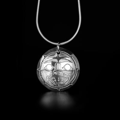 Sterling Silver Double-Sided Moon Pendant hand-carved by Coast Salish artist Gilbert Pat. Pendant measures approximately 0.90" x 0.80" including bail. Chain not included.