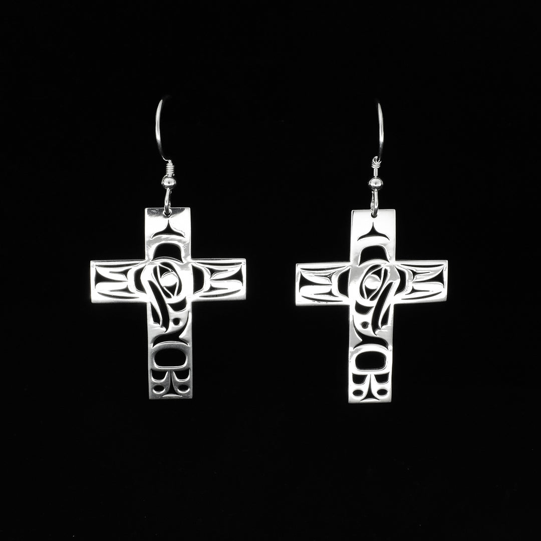 These sterling silver cross earrings have wide, cross shaped hangs with cutout designs depicting the Eagle on the them.