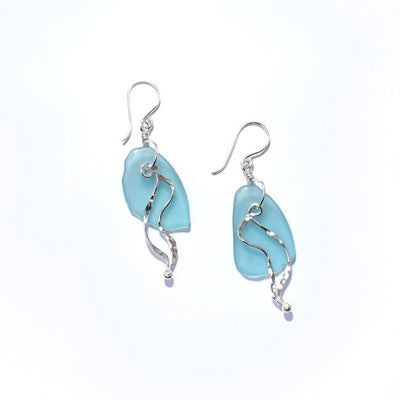 Fish floating kelp earrings handcrafted by artist Kim Naylor. Made of sterling silver and sea glass. Each earring measures 2.50" x 0.75" including the hook.