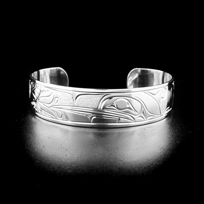 Hummingbird bracelet hand-carved by Kwakwaka'wakw artist Cristiano Bruno. Made of sterling silver. Bracelet is 6.13" long with 1.13" gap and has width of 0.63".