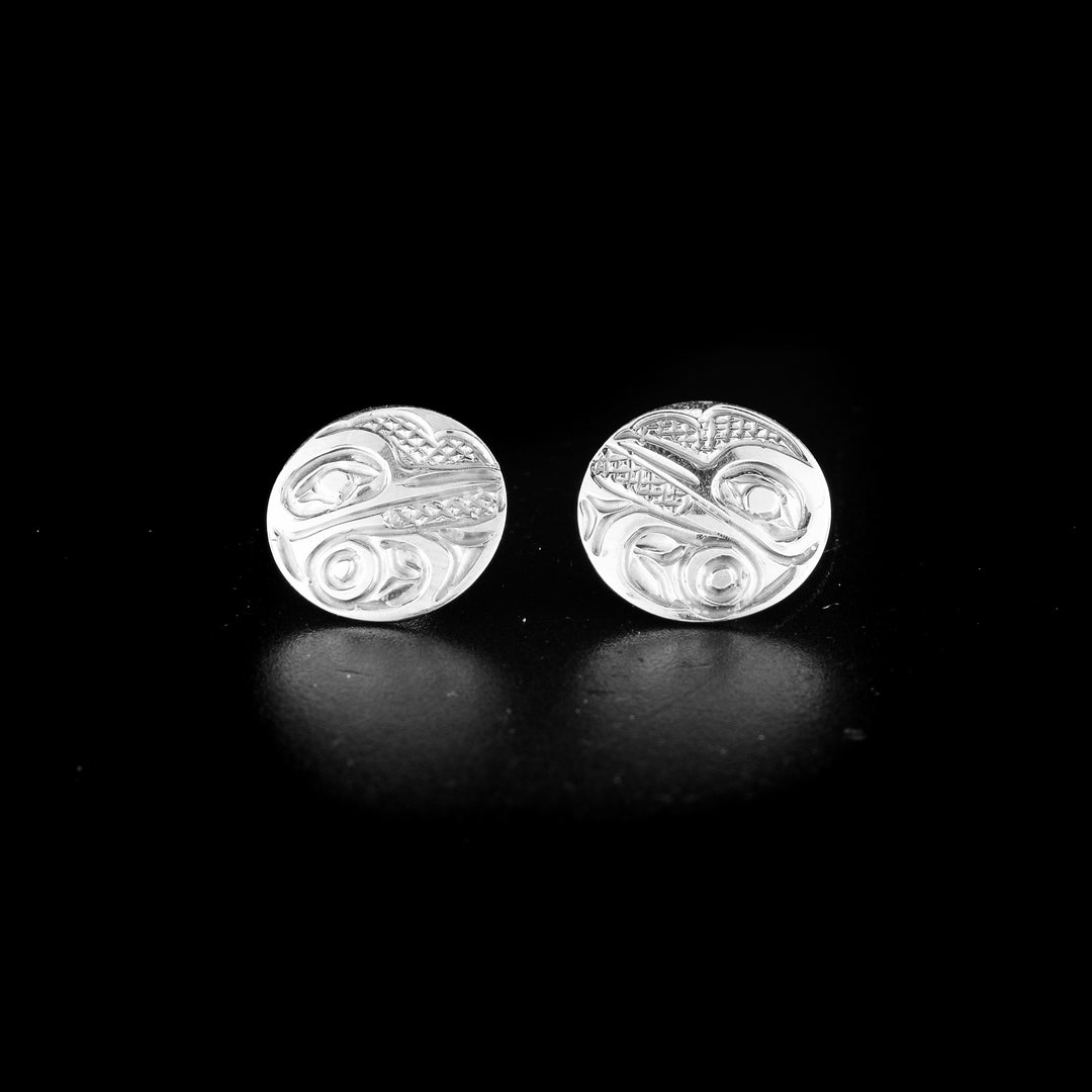 Hummingbird stud earrings hand-carved by Kwakwaka'wakw artist Carrie Matilpi. Made of sterling silver. Each earring is 0.63" in diameter.