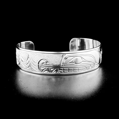 Elegant wolf bracelet hand-carved by Kwakwaka'wakw artist Cristiano Bruno. Made of sterling silver. Bracelet is 6.25" long with 1.25" gap and has width of 0.63".