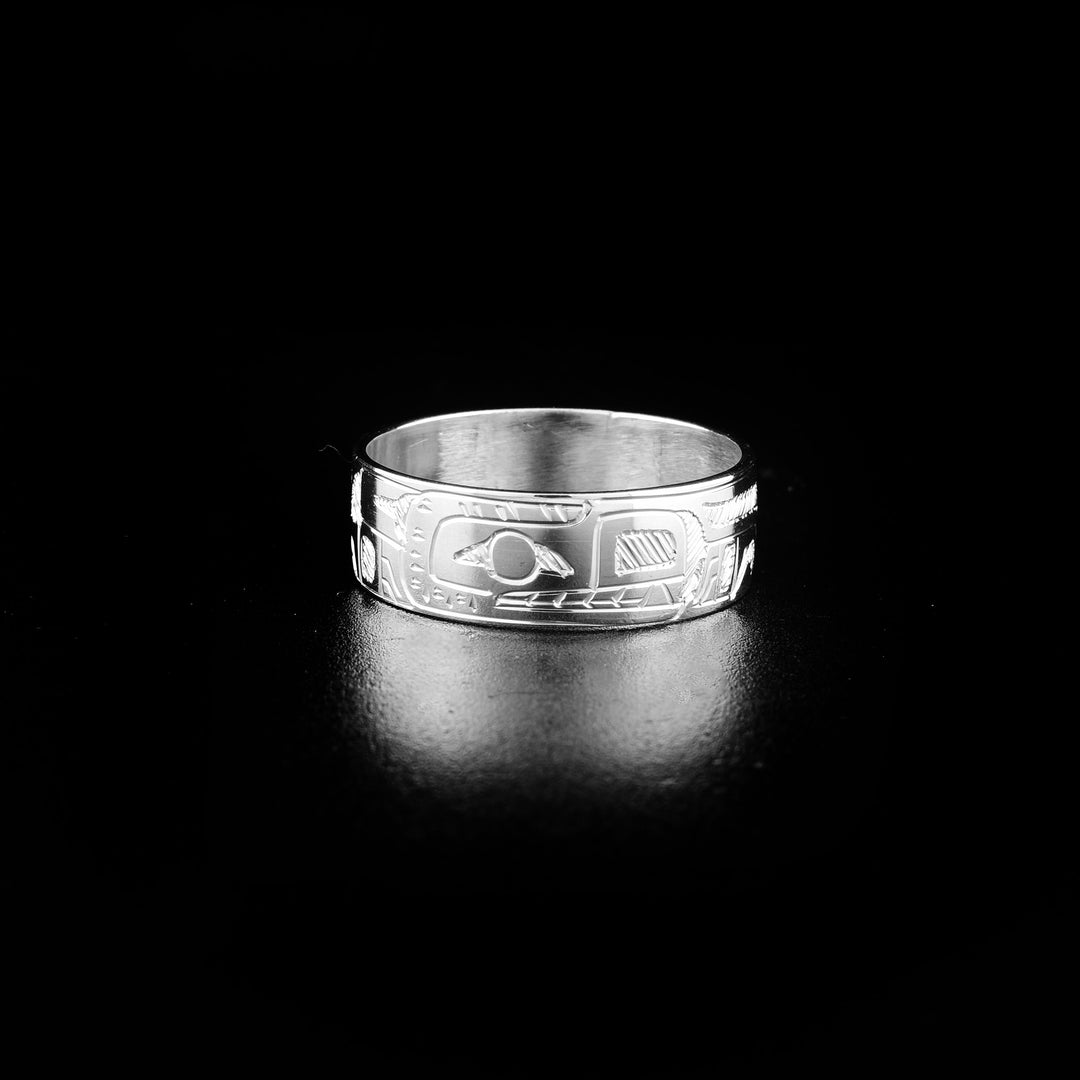 This sterling silver band ring has a depiction of the Bear carved into the surface of it.