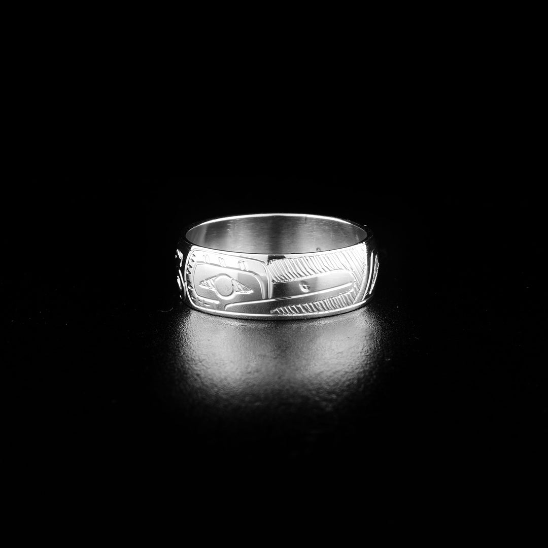 This Hummingbird ring is made from sterling silver and has a single, medium band. There is a depiction of the Hummingbird carved into the surface of the band.