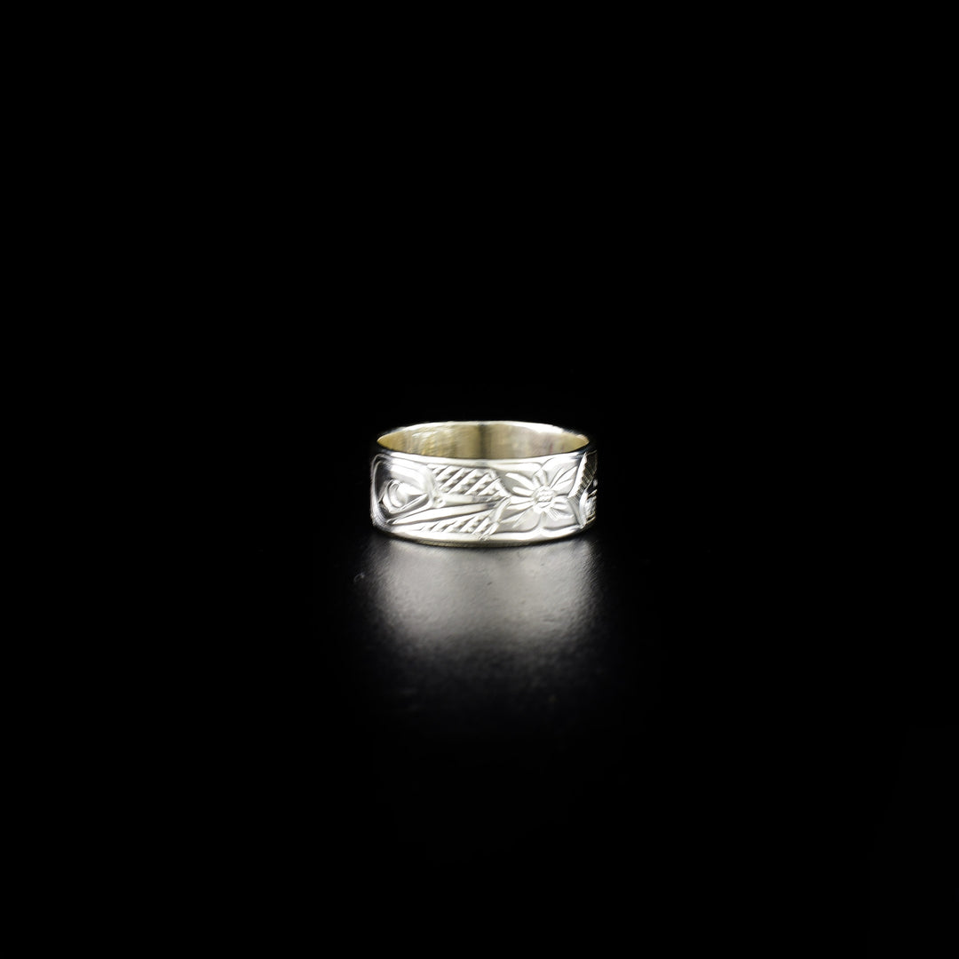 Raven and hummingbird ring hand-carved by Coast Salish and Cree artist Richard Lang. Made of sterling silver. Width of band is 0.31".  Size 9.