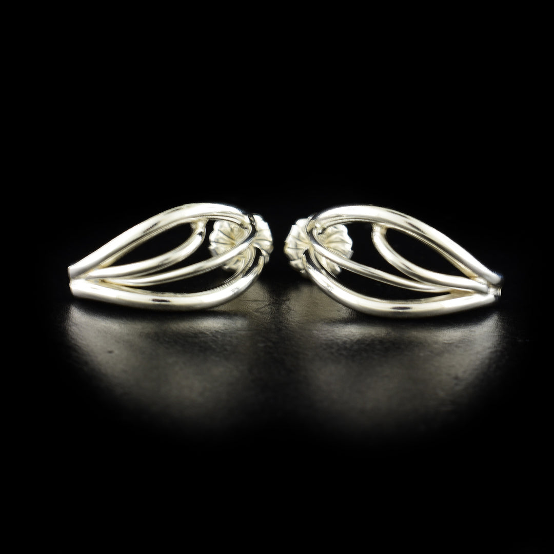 Unique stud earrings handcrafted by artist Lynda Constantine. Made of sterling silver. Each earring measures 0.81" x 0.38".