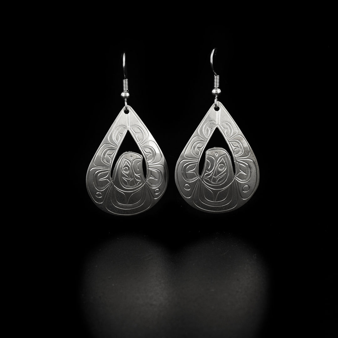 These flying Eagle earrings are made from sterling silver and have teardrop shaped hangs with a few cutout designs on it. The hangs have carvings on the surface of it depicting the Eagle and its wings are outstretched and reaching upwards.