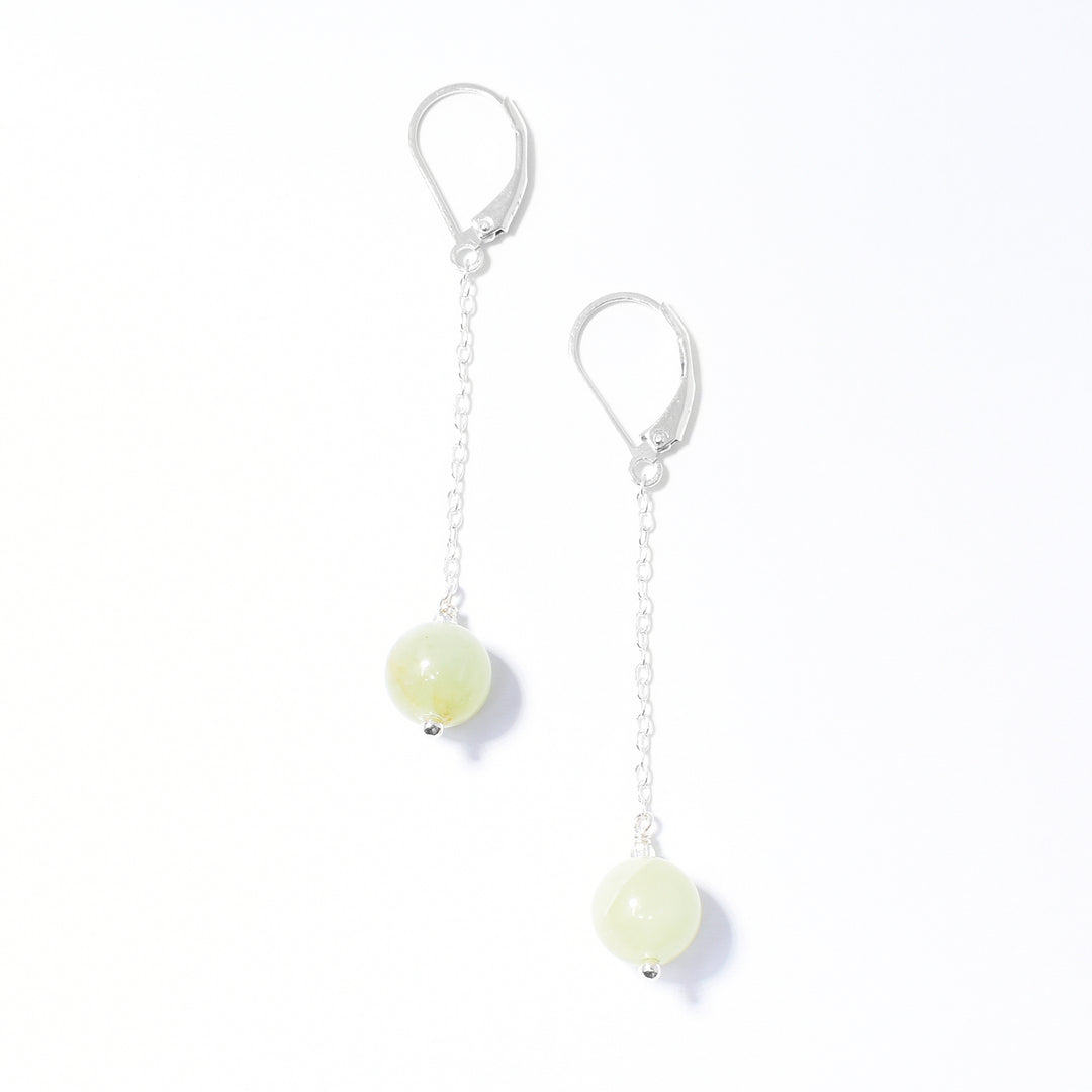 Unique lever back earrings handcrafted by artist Debra Nelson. Made of sterling silver and green aquamarine. Each earring measures 2.25" x 0.31" including hook.