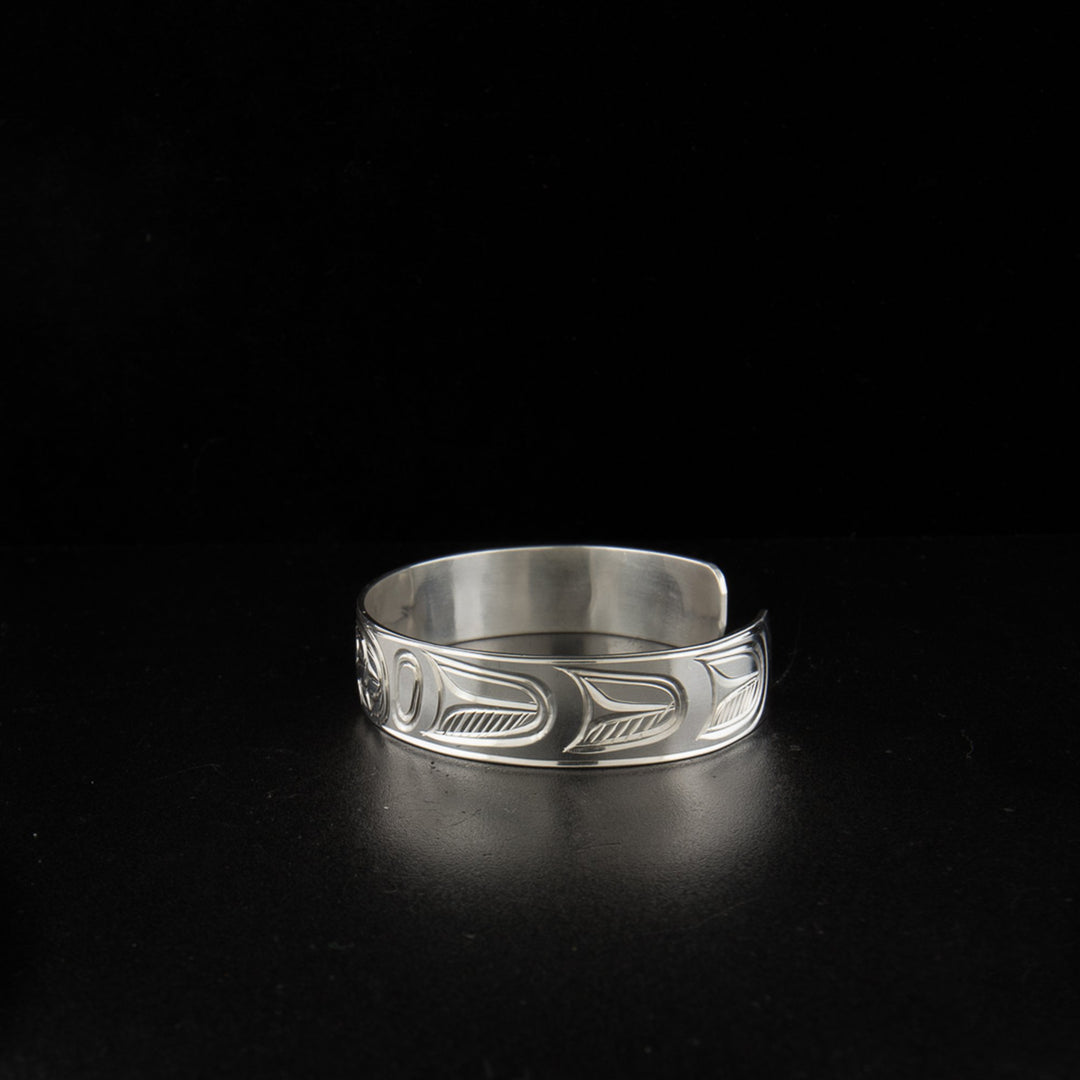Sterling silver raven bracelet hand-carved by artist Paddy Seaweed.