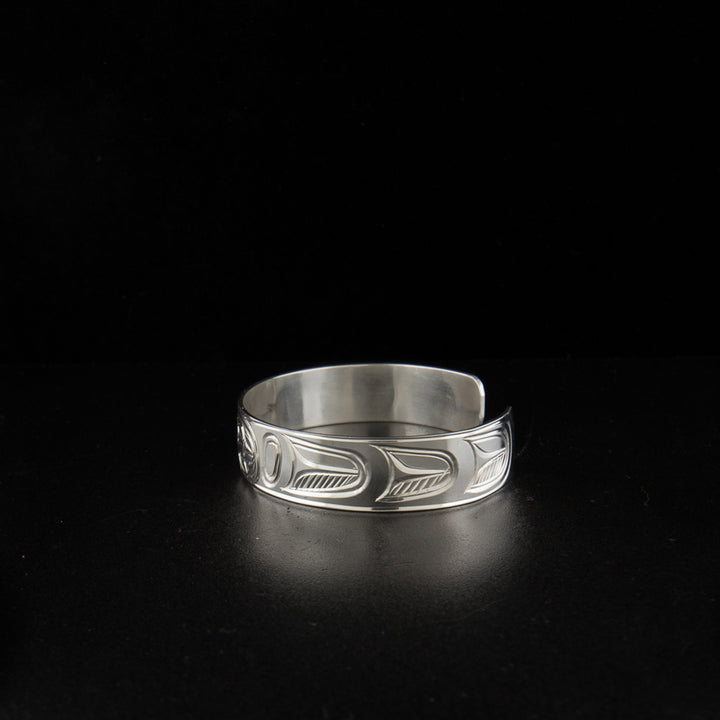 Sterling silver raven bracelet hand-carved by artist Paddy Seaweed.
