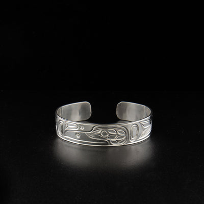 Sterling silver raven bracelet hand-carved by artist Paddy Seaweed.