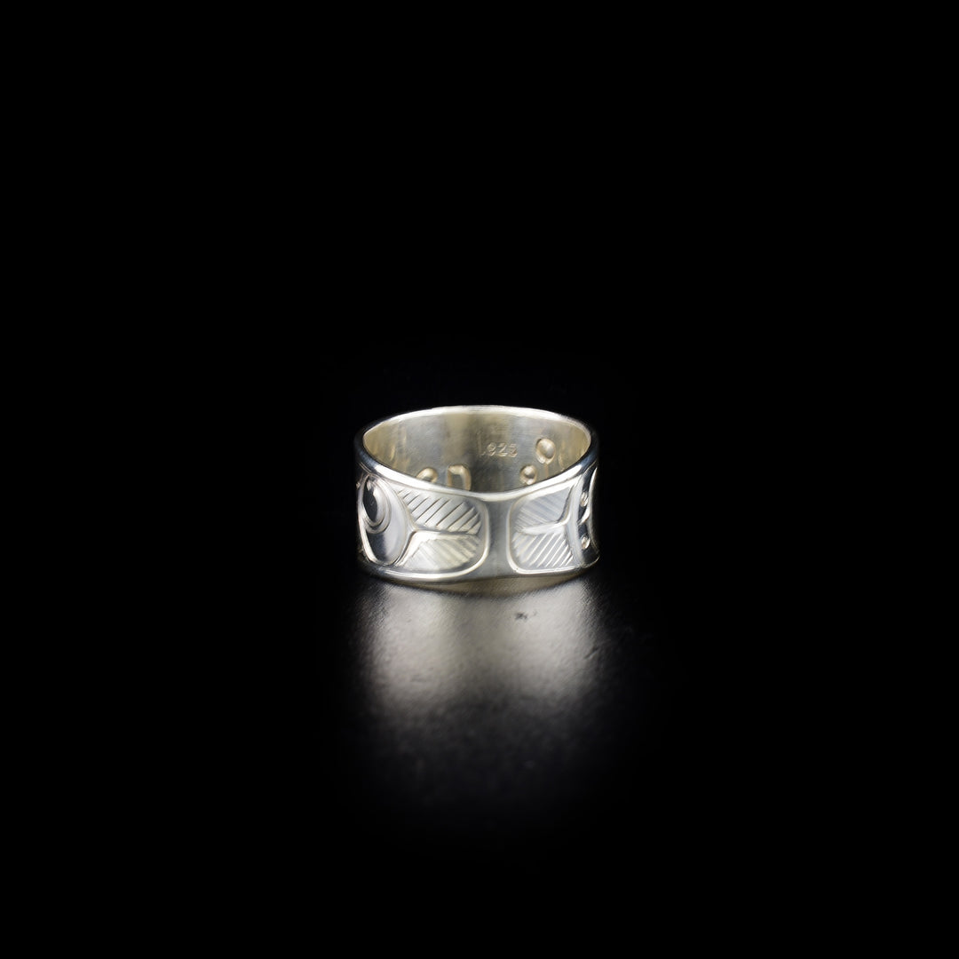 Tapered raven ring hand-carved by Coast Salish and Cree artist Richard Lang. Made of sterling silver. Ring is 0.50" in the front and tapers down to 0.25" in the back. Size 9.5.