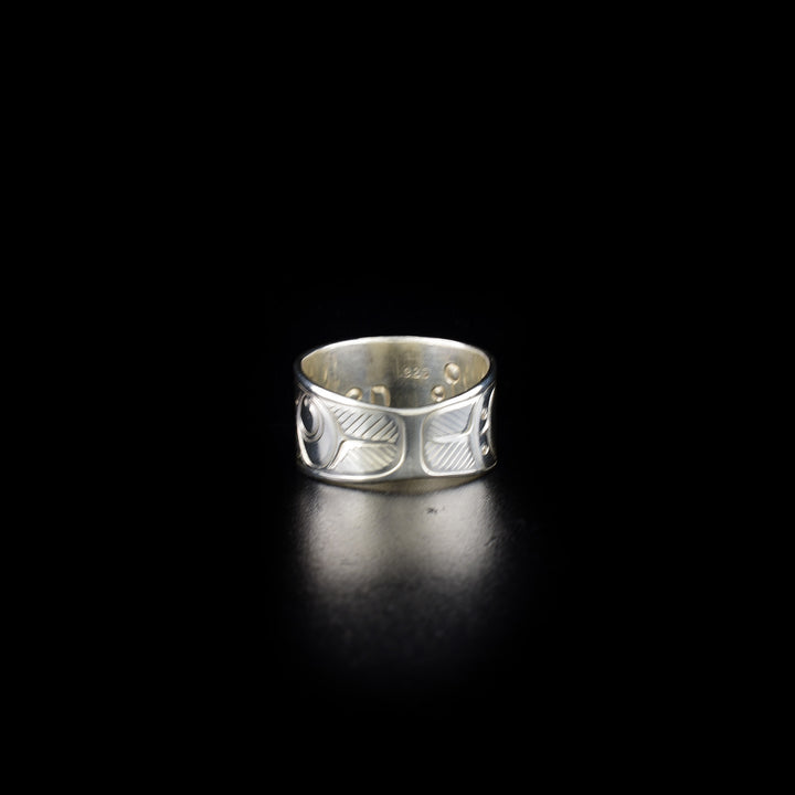 Tapered raven ring hand-carved by Coast Salish and Cree artist Richard Lang. Made of sterling silver. Ring is 0.50" in the front and tapers down to 0.25" in the back. Size 9.5.