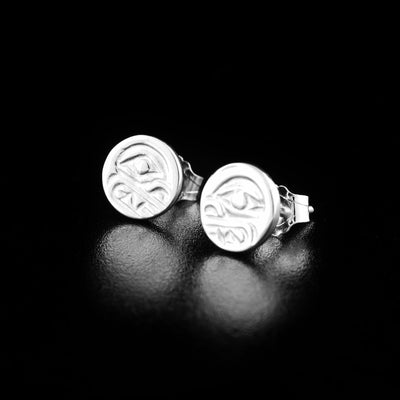Delicate mini bear cast studs handcrafted by Kwakwaka'wakw artist Carrie Matilpi. Made of sterling silver. Each earring measures approximately 0.25" in diameter.
