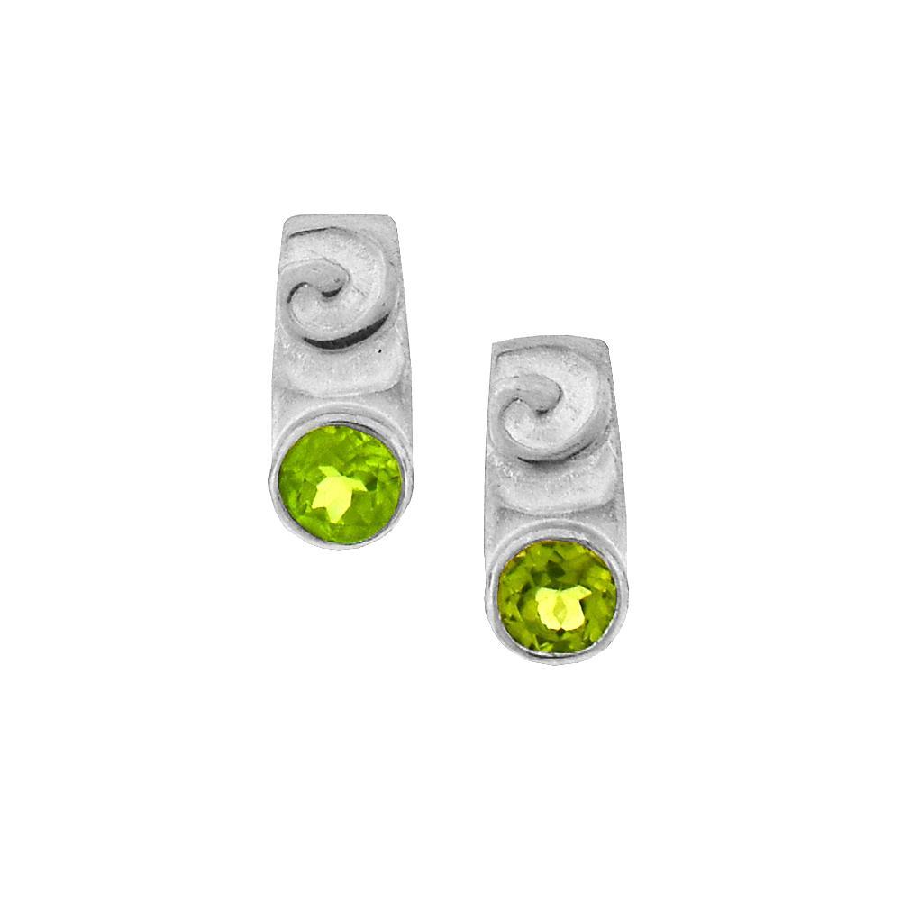These peridot stud earrings are made from sterling silver and peridot gemstones. There are swirly patterns on the silver and the gems are faceted into the earrings.