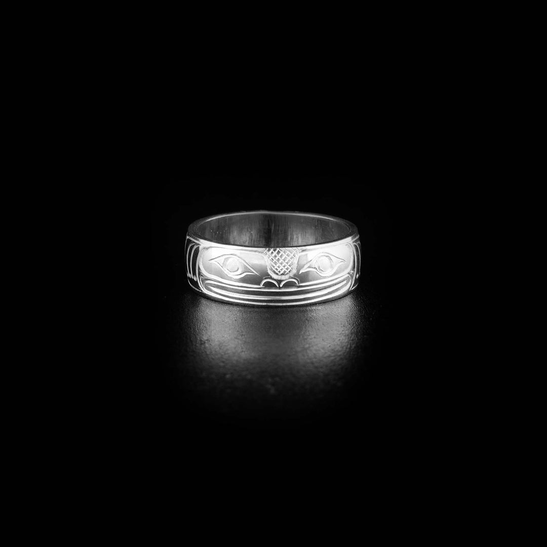 Sterling Silver 1/4" Frog Ring by Travis Henry. The design depicts a frog's head looking forward in the center of the ring. On both sides of the head the artist has hand carved intricate designs representing the frog's arms and legs in a sitting position.