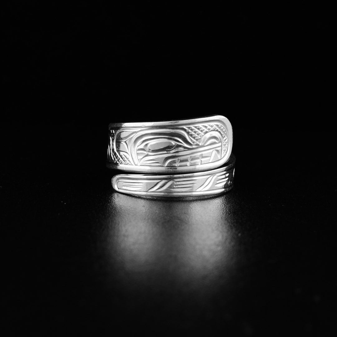 This sterling silver Wolf ring has a tapered band that wraps around the finger twice. There is a depiction of the Wolf carved into the surface of the band.
