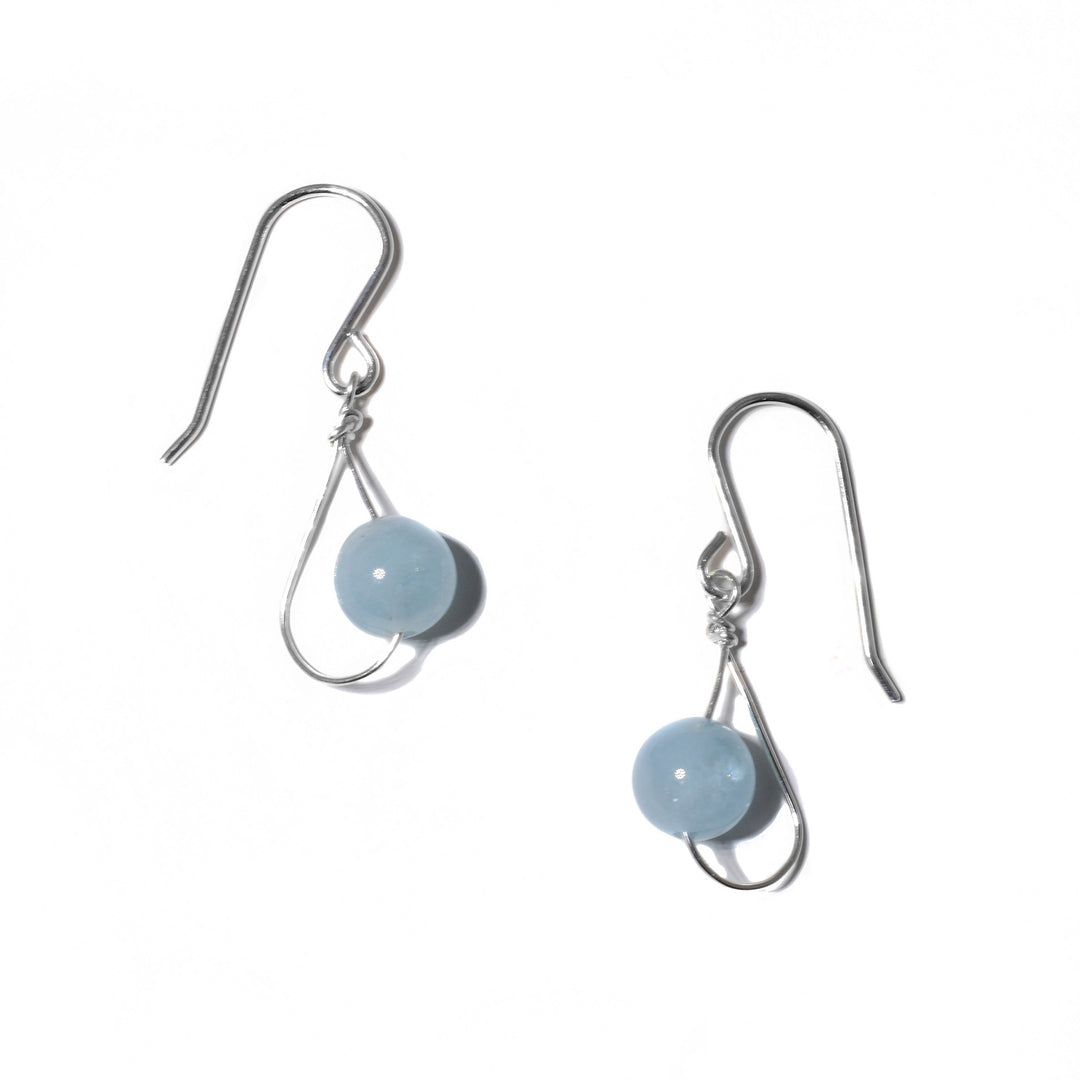 Delicate earrings handcrafted by artist Pamela Lauz. Made of sterling silver wire and aquamarine. Each earring measures 1.18" x 0.38" including hook.