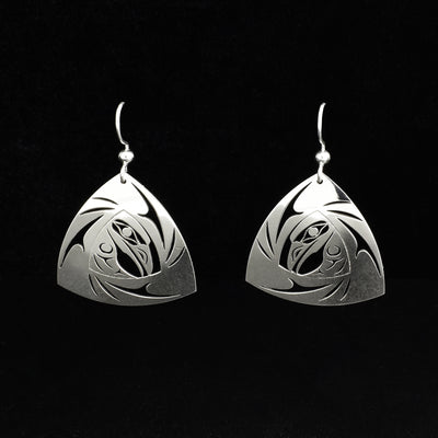 Unique raven triangle earrings by Tahltan artist Grant Pauls. Made of sterling silver. Each earring measures 1.50" x 1" including hook.