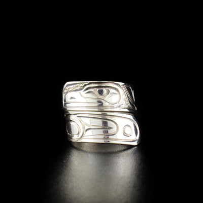 Stunning raven wrap ring hand-carved by Kwakwaka'wakw artist Paddy Seaweed. Made of sterling silver. Width of band is 0.31". Size 5.5.