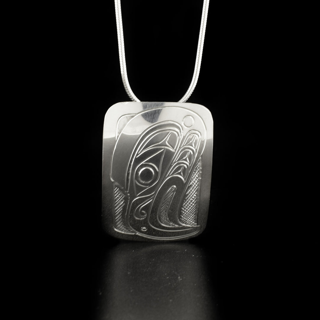 This Eagle pendant is made using sterling silver and have a wide, short rectangle shape. There is a depiction of the Eagle that has been beautifully carved into the surface of the piece.
