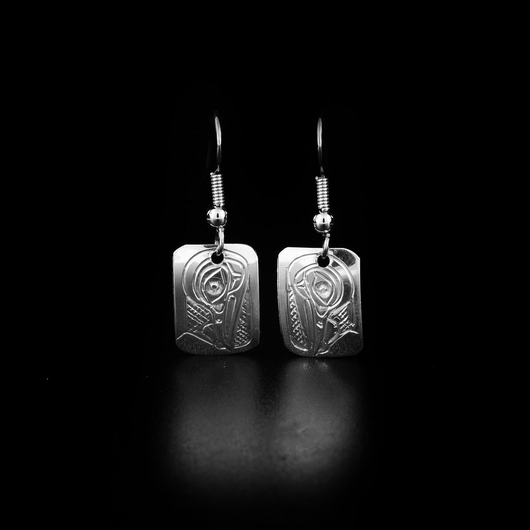 These dangling Hummingbird earrings are made from sterling silver and have small, rectangular hangs. There are gorgeous depictions of the Hummingbird carved into the hangs.