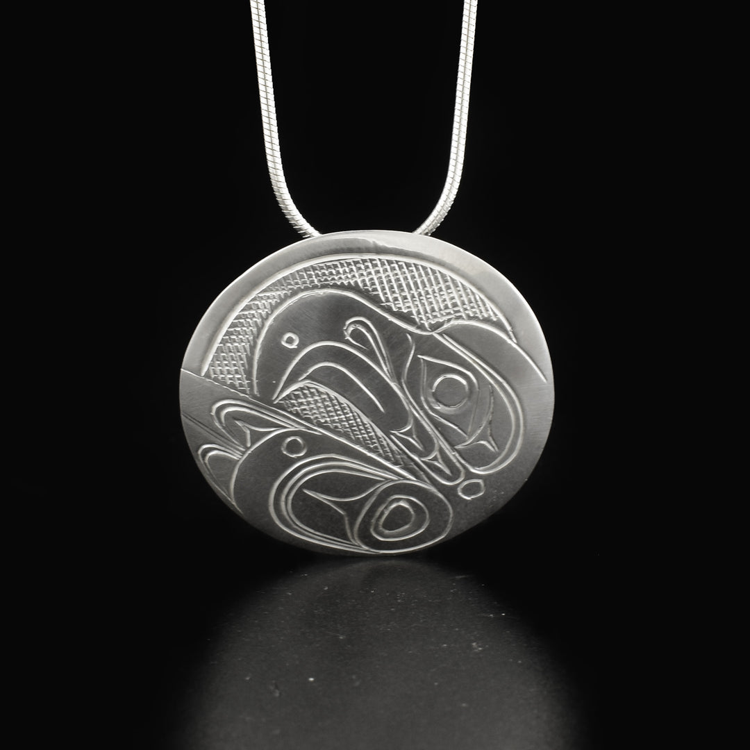 This Eagle pendant is made using sterling silver and has a circle shape. There is a depiction of the head of the Eagle that have been beautifully carved into the surface of the piece.