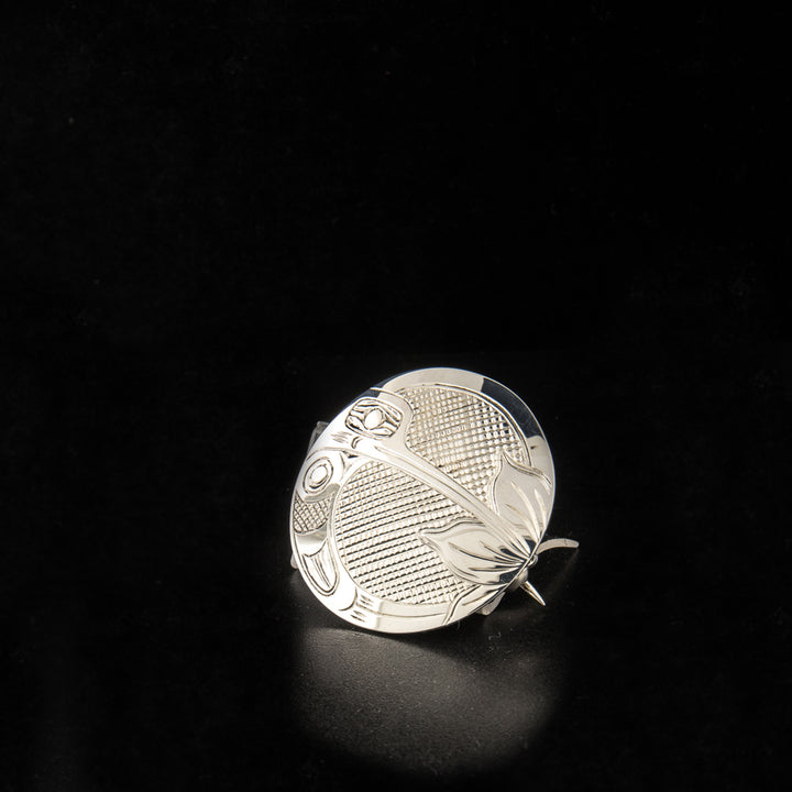 Sterling silver round hummingbird pin/pendant hand-carved by Kwakwaka'wakw artist Harold Alfred. 1.5" in diameter. Hidden bail on back.