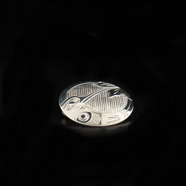 Sterling silver round hummingbird pin/pendant hand-carved by Kwakwaka'wakw artist Harold Alfred. 1.5" in diameter. Hidden bail on back.