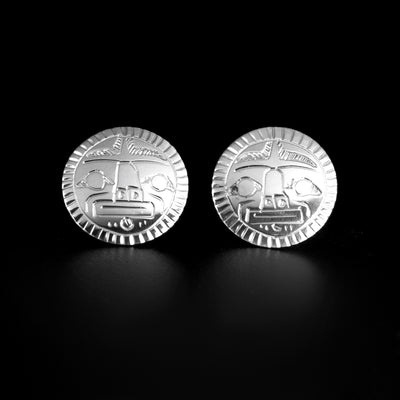 Detailed round moon stud earrings hand-carved by Coast Salish artist Gilbert Pat. Made of sterling silver. Each earring is 0.50" in diameter.