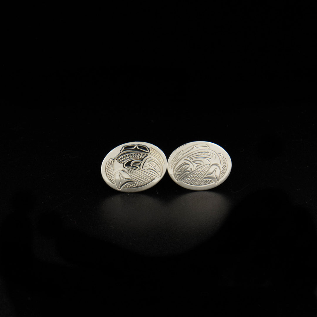 Sterling silver salmon cufflinks hand-carved by Kwakwaka'wakw artist John Lancaster. Each cufflink measures 0.63" x 0.81".