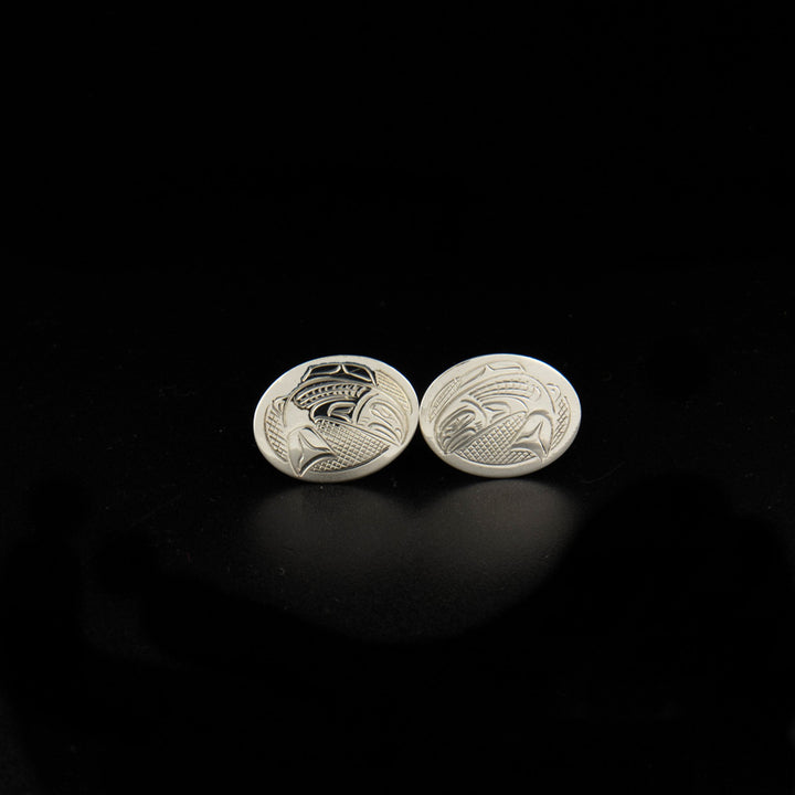Sterling silver salmon cufflinks hand-carved by Kwakwaka'wakw artist John Lancaster. Each cufflink measures 0.63" x 0.81".