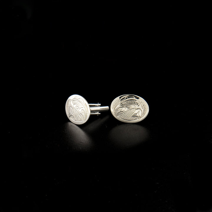 Sterling silver salmon cufflinks hand-carved by Kwakwaka'wakw artist John Lancaster. Each cufflink measures 0.63" x 0.81".