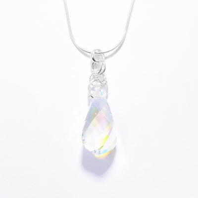 Sterling Silver Swarovski Crystal Helix Pendant handcrafted by artist Debra Nelson. The crystal has four corners that twist into a helix shape. Made of sterling silver and Aurora Borealis Swarovski Crystal. Pendant measures 1.81" x 0.56" including bail. Chain not included.