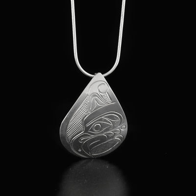 Detailed teardrop thunderbird pendant hand-carved by Kwakwaka'wakw artist Don Lancaster. Made of sterling silver. Pendant measures 1.50" x 1". Hidden bail on back. Chain not included.
