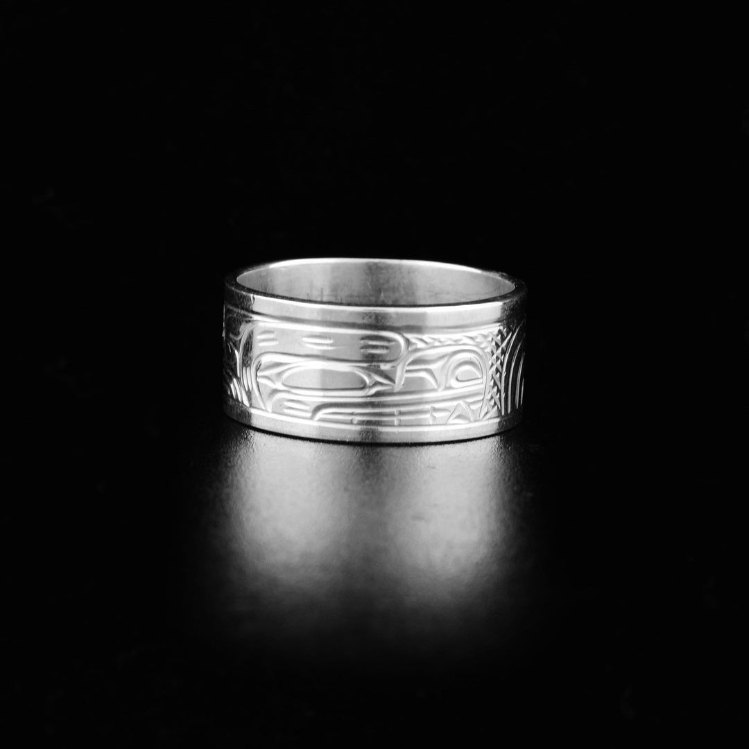 This wide silver band ring is made from sterling silver and has a chunky depiction of the Bear carved into the surface of the ring.