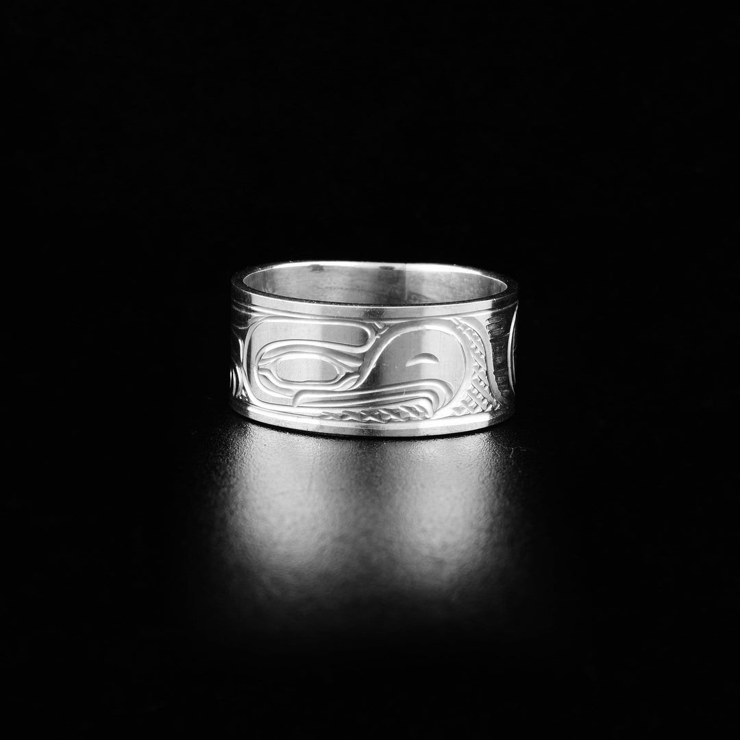 This heavy gauge Eagle ring is made from sterling silver and has a wide band. There is a depiction of the Eagle carved into the surface of the band.