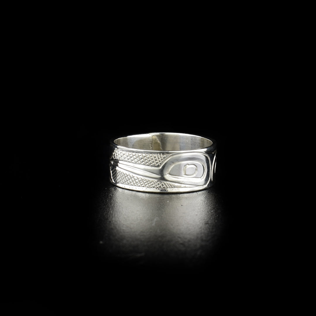 Stunning Hummingbird ring hand-carved by Kwakwaka'wakw artist Norman Seaweed. Made of sterling silver. Ring has width of 0.38". Size 9.