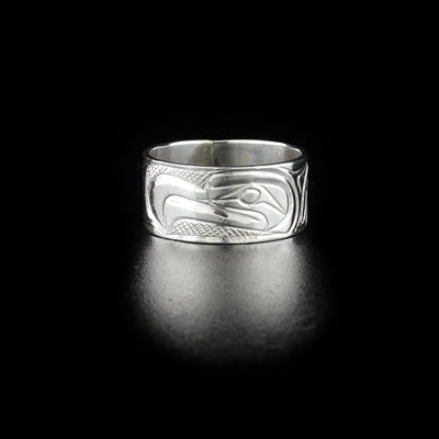 Unique thunderbird ring hand-carved by Kwakwaka'wakw artist Norman Seaweed. Made of sterling silver. Ring has width of 0.38". Size 9.5.