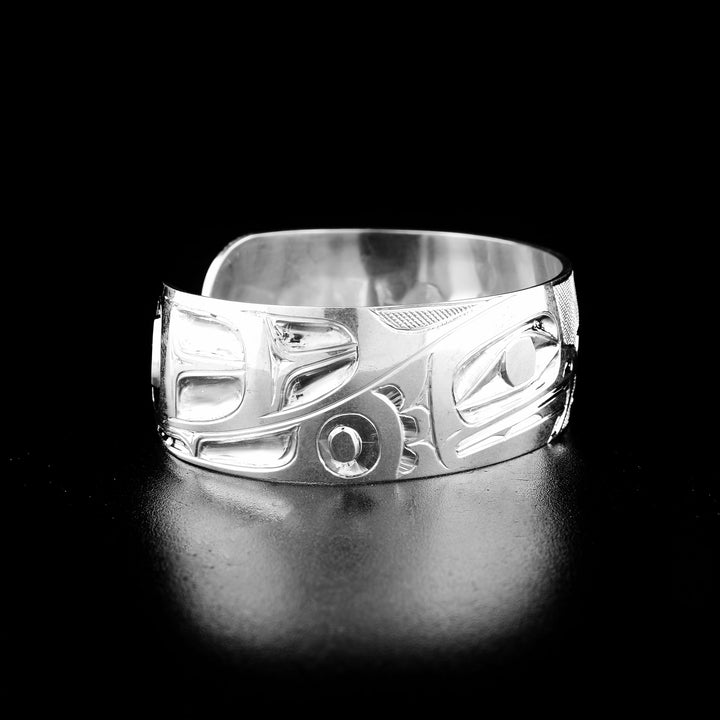 Eagle and bear bracelet hand-carved by indigenous artist Ivan Thomas. Made of sterling silver. Bracelet is 6.3" long with 0.6" gap and has width of 0.75".