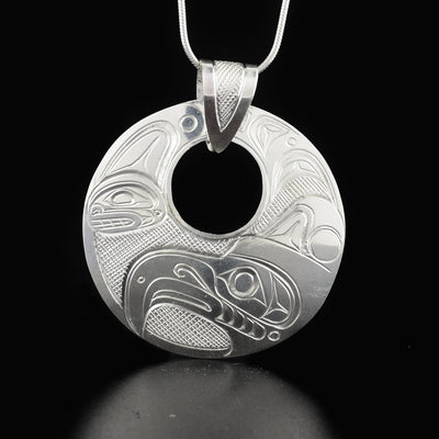 Elegant thunderbird cut out pendant hand-carved by Kwakwaka'wakw artist Don Lancaster. Made of sterling silver. Pendant measures 2.2" x 2" including bail. Chain not included.