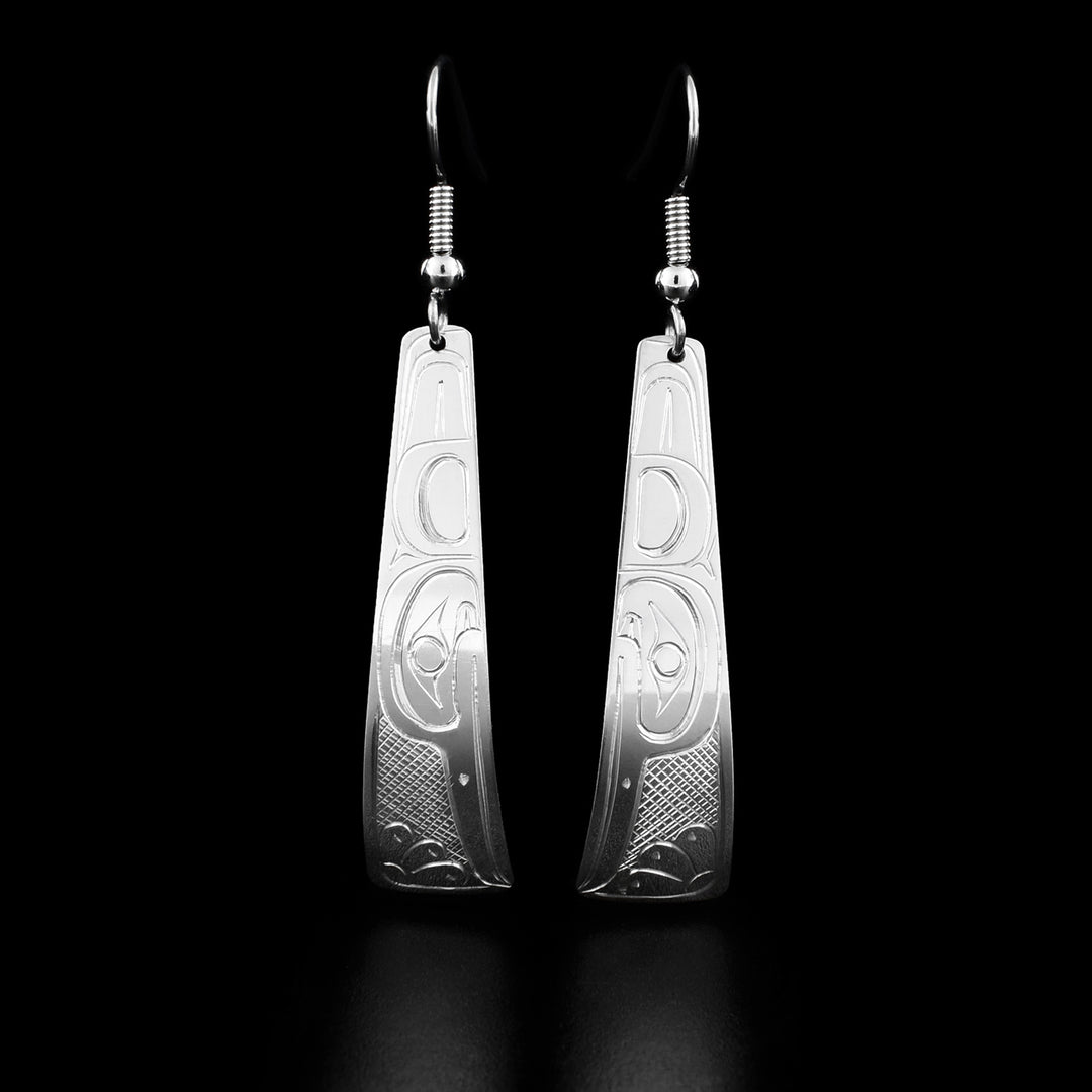 These hummingbird earrings are triangle shaped and have the profile of a hummingbird's head with a large feather and a small, narrow beak facing downwards.