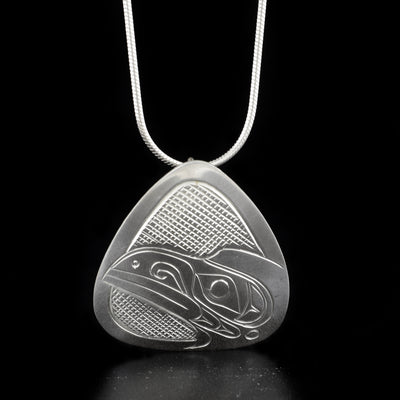 Unique triangle raven pendant hand-carved by Kwakwaka'wakw artist Don Lancaster. Made of sterling silver. Pendant measures 1.25" x 0.81". Hidden bail on back. Chain not included.