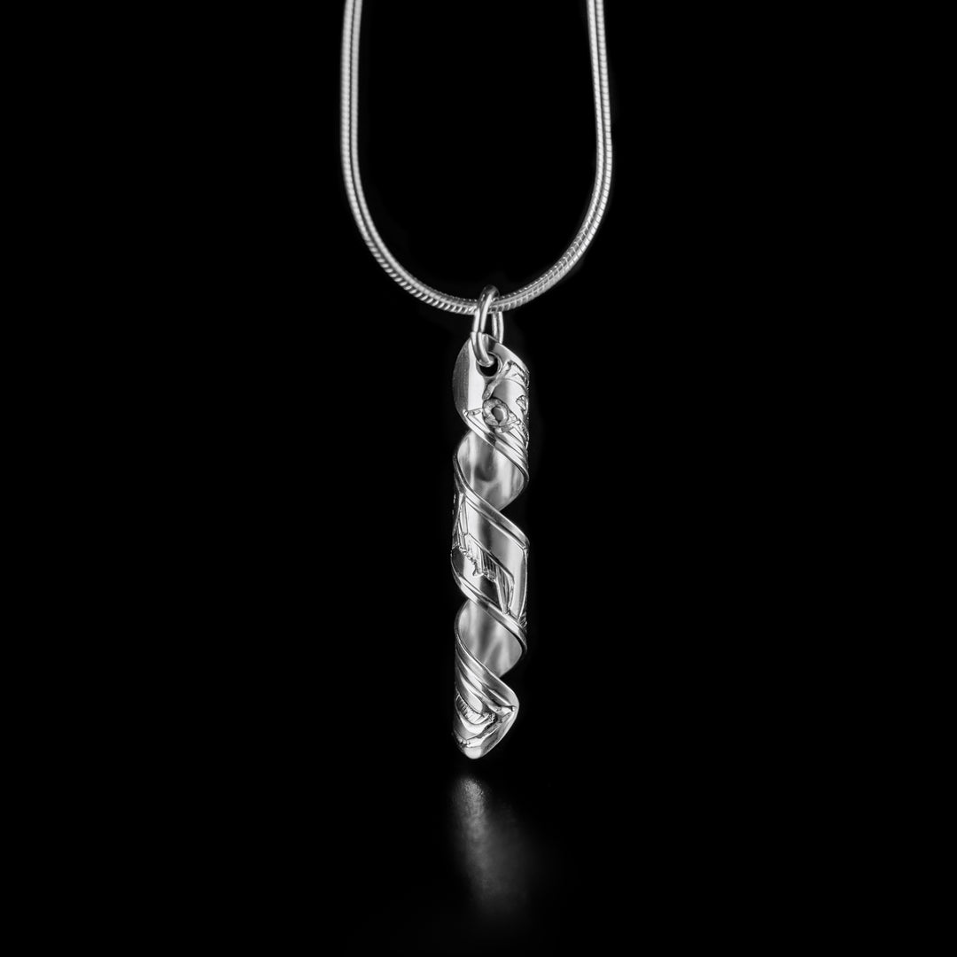 This unique spiral pendant is made from sterling silver and is a band that has been coiled into a vertical spiral. There is a depiction of the Raven carved into the surface of the band.