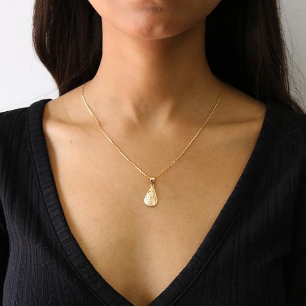 14K Gold Teardrop Hummingbird Pendant is hand carved by artist Carrie Matilpi