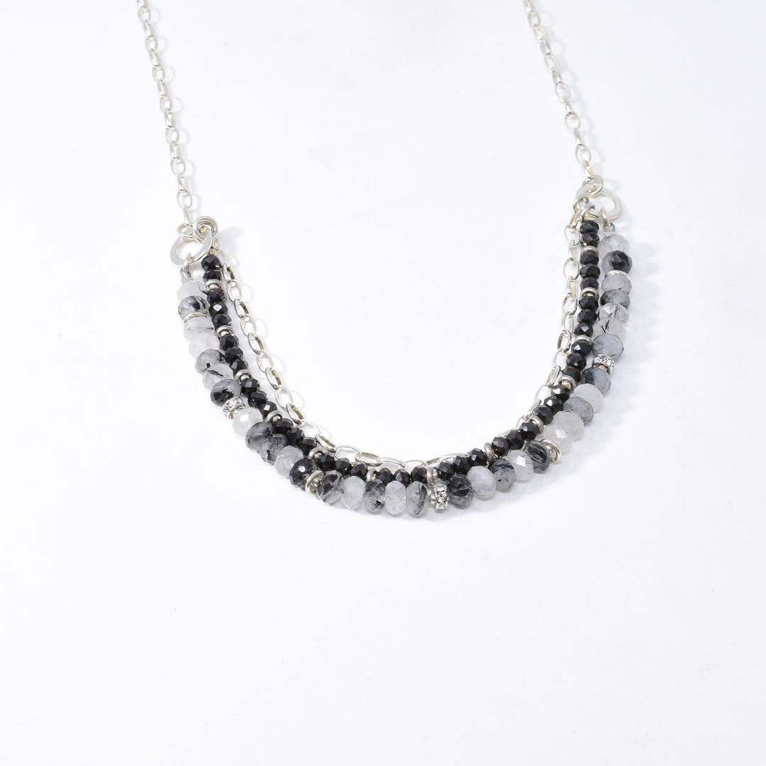 Tourmalinated Quartz and Swarovski Crystal Necklace handcrafted by artist Karley Smith. Made of sterling silver, Swarovski Crystal and tourmalinated quartz. Necklace is 20" long.