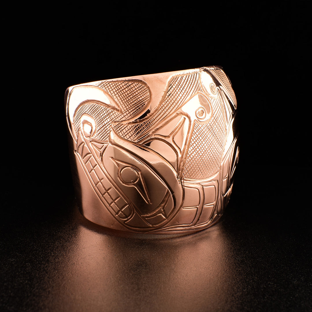 Photo of the right side of the bracelet shows carved design of one Sisiutl head.