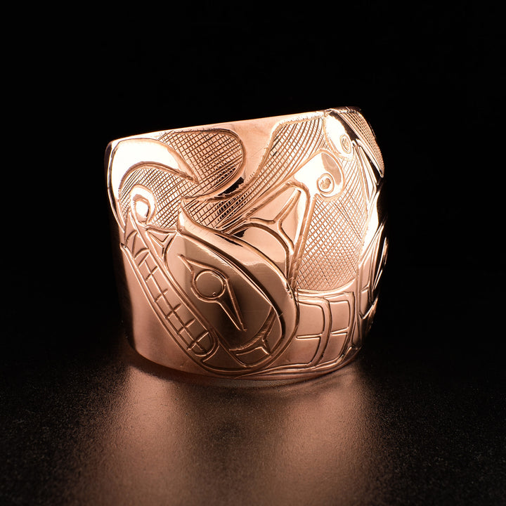 Photo of the right side of the bracelet shows carved design of one Sisiutl head.